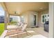 Covered patio with seating area and outdoor grill at 10507 Daybreak Gln, Parrish, FL 34219