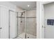 Walk-in shower with tiled walls and a built-in seat at 10507 Daybreak Gln, Parrish, FL 34219
