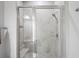 Large walk-in shower with glass enclosure and tiled walls at 10507 Daybreak Gln, Parrish, FL 34219