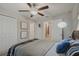 Well-lit bedroom with a comfortable bed, and built in closet at 11628 N Castine St, New Port Richey, FL 34654