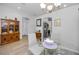 Dining room with glass table, chairs, and built-in hutch at 12150 Putter Green Ct, New Port Richey, FL 34654