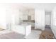 Modern kitchen with white cabinets and large island at 142 Fairway Rd, Rotonda West, FL 33947