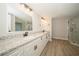 Modern bathroom with granite countertops and a glass shower at 15909 Amberly Dr, Tampa, FL 33647