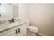 Updated bathroom with granite countertop and white vanity at 15909 Amberly Dr, Tampa, FL 33647
