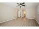 Large bedroom with wood-look floors and access to bathroom at 15909 Amberly Dr, Tampa, FL 33647