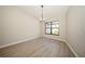 Light-filled dining area with laminate floors and a chandelier at 15909 Amberly Dr, Tampa, FL 33647