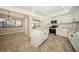 Updated kitchen with island, stainless steel appliances, and tile floors at 15909 Amberly Dr, Tampa, FL 33647