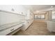 Modern kitchen featuring granite countertops and white cabinetry at 15909 Amberly Dr, Tampa, FL 33647