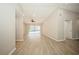 Bright and airy living room with laminate floors and sliding glass doors at 15909 Amberly Dr, Tampa, FL 33647