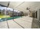Relaxing screened pool and patio with paver deck at 15909 Amberly Dr, Tampa, FL 33647