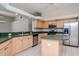 Modern kitchen with island, stainless steel appliances, and dark countertops at 18017 Kings Park Dr, Tampa, FL 33647