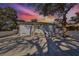 Home exterior view at dusk, showcasing a large backyard patio at 1846 3Rd S St, St Petersburg, FL 33705