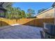 Spacious paved backyard with wooden fence and AC unit at 1846 3Rd S St, St Petersburg, FL 33705