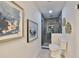 Clean bathroom with walk-in shower and gray tile at 1846 3Rd S St, St Petersburg, FL 33705