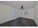 Spacious bedroom with dark hardwood floors and two windows at 1846 3Rd S St, St Petersburg, FL 33705