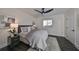 Serene bedroom with ceiling fan, dark hardwood floors and large window at 1846 3Rd S St, St Petersburg, FL 33705