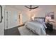 Comfortable bedroom with ceiling fan, and dark hardwood floors at 1846 3Rd S St, St Petersburg, FL 33705
