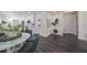 Modern dining area with glass-top table and dark gray chairs at 1846 3Rd S St, St Petersburg, FL 33705
