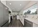 Modern kitchen boasts stainless steel appliances and white cabinetry at 1846 3Rd S St, St Petersburg, FL 33705