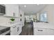Modern kitchen with white shaker cabinets, quartz countertops, and stainless steel appliances at 1846 3Rd S St, St Petersburg, FL 33705