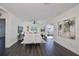 Open living room with hardwood floors and view into adjacent dining area at 1846 3Rd S St, St Petersburg, FL 33705