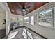 Sunroom with wood ceiling, hardwood floors, and view of street at 1846 3Rd S St, St Petersburg, FL 33705