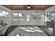 Bright sunroom with wood ceiling, hardwood floors, and ample natural light at 1846 3Rd S St, St Petersburg, FL 33705