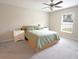 Comfortable bedroom with a queen bed and nightstands at 1983 Fan Aloe Way, Ruskin, FL 33570