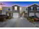 Modern two-story townhome, two-car garage, and driveway at 2909 Beluga Bay Dr, Odessa, FL 33556