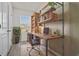 Home office with rustic wooden desk and industrial shelving at 2909 Beluga Bay Dr, Odessa, FL 33556