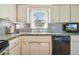 Galley kitchen with updated countertops and sink at 3862 21St N Ave, St Petersburg, FL 33713