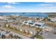 Aerial view of a condo building and surrounding neighborhood, near the water at 460 Paula S Dr # 101, Dunedin, FL 34698