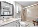 Clean bathroom with walk-in shower and white vanity at 460 Paula S Dr # 101, Dunedin, FL 34698