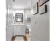 Well-lit bathroom with white vanity and walk-in shower at 460 Paula S Dr # 101, Dunedin, FL 34698