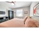 Bedroom with a queen-size bed and built-in storage at 460 Paula S Dr # 101, Dunedin, FL 34698