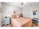 Guest bedroom with a queen bed, decorative accents, and ample closet space at 460 Paula S Dr # 101, Dunedin, FL 34698