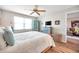 Bright bedroom with a queen-size bed and ceiling fan at 460 Paula S Dr # 101, Dunedin, FL 34698