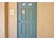 Exterior view of a teal clubhouse door with a no smoking sign at 460 Paula S Dr # 101, Dunedin, FL 34698