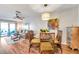 Charming dining area with glass table and wicker chairs at 460 Paula S Dr # 101, Dunedin, FL 34698