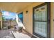 Condo entry with a bench and door leading inside at 460 Paula S Dr # 101, Dunedin, FL 34698