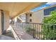 Exterior hallway with stairs and a view of landscaping at 460 Paula S Dr # 101, Dunedin, FL 34698