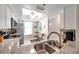 Kitchen with granite countertops, stainless steel appliances, and breakfast nook at 460 Paula S Dr # 101, Dunedin, FL 34698