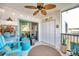 Bright lanai with Florida-themed decor and access to laundry closet at 460 Paula S Dr # 101, Dunedin, FL 34698