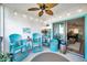 Relaxing lanai with outdoor seating, string lights, and view of community at 460 Paula S Dr # 101, Dunedin, FL 34698