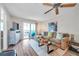 Comfortable living room with sectional sofa and wood floors at 460 Paula S Dr # 101, Dunedin, FL 34698