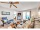 Open living area features a sectional sofa and wood floors at 460 Paula S Dr # 101, Dunedin, FL 34698