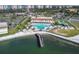 Aerial view of community pool, clubhouse, and tennis courts at 5220 Brittany S Dr # 610, St Petersburg, FL 33715