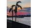 Scenic sunset view over the water with palm trees and boat at 5220 Brittany S Dr # 610, St Petersburg, FL 33715