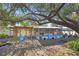 Relaxing backyard oasis featuring a pergola, patio, and lush landscaping at 5301 16Th N Ave, St Petersburg, FL 33710