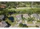 Aerial view of the property outlined in blue, highlighting the backyard pond and golf course views at 5951 Bay Dr, Gulfport, FL 33707